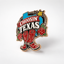 Texas-themed enamel pin reading “Choosin’ Texas” with blue state outline, cowboy boots, roses, rope, and gold star
