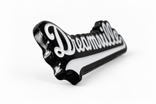 Side of Dreamville enamel pin showing metal pin posts