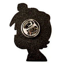 Back of yellow Lil Uzi Vert enamel pin showing metal pin posts