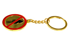 Detailed view of Travis Scott No Bystanders keychain showing red and gold enamel design